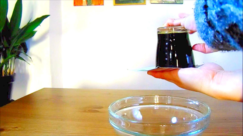 Step 3: In this step, we flip the cup or glass. Make sure you have the glass in the middle of the card.